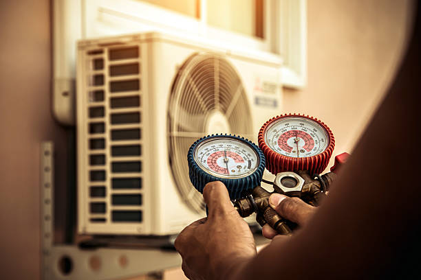 Professional Heat Pump Repair technician working in Gloucester, MA